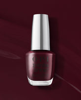 OPI Infinite Shine Mrs. O'Leary's BBQ deep burgundy gel-like lacquer bottle stands against a matching glossy wine-red background, showcasing a rich shade for fall nail colors.