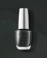 OPI Infinite Shine Nein! Nein! Nein! OK Fine! dark green-gray gel-like lacquer bottle with silver cap on a moody dark background, a sleek choice for fall nail colors.