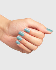 OPI Reality Check Ya Out Nail Lacquer green nail polish coating neatly manicured nails—a shimmery mint hue—shown in a close-up hand pose against a light gray background, a fresh pick for spring nail colors.