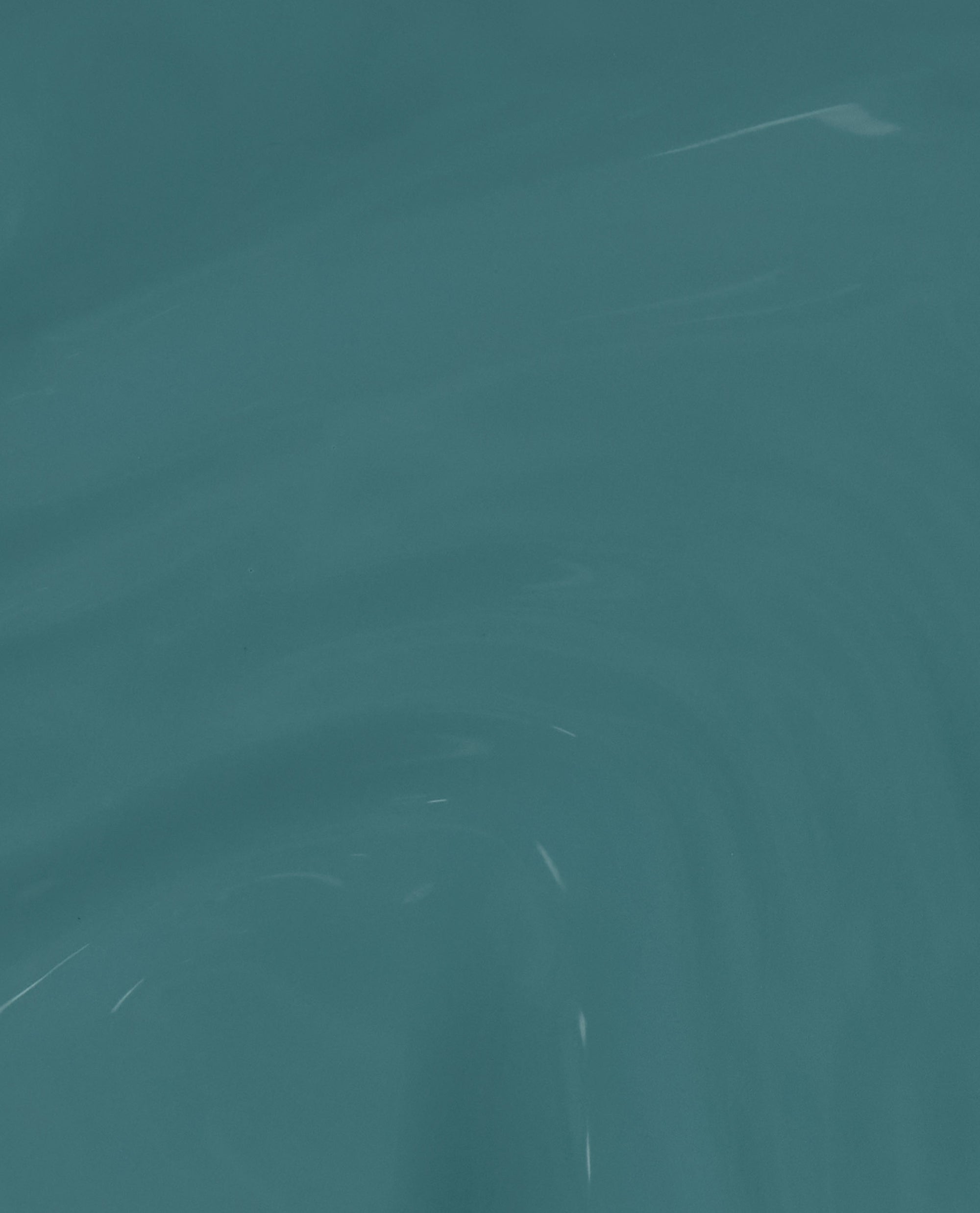 Baby Tee-l OPI nail polish swatch showing a smooth, glossy teal nail lacquer finish with subtle light reflections across the creamy, opaque color.
