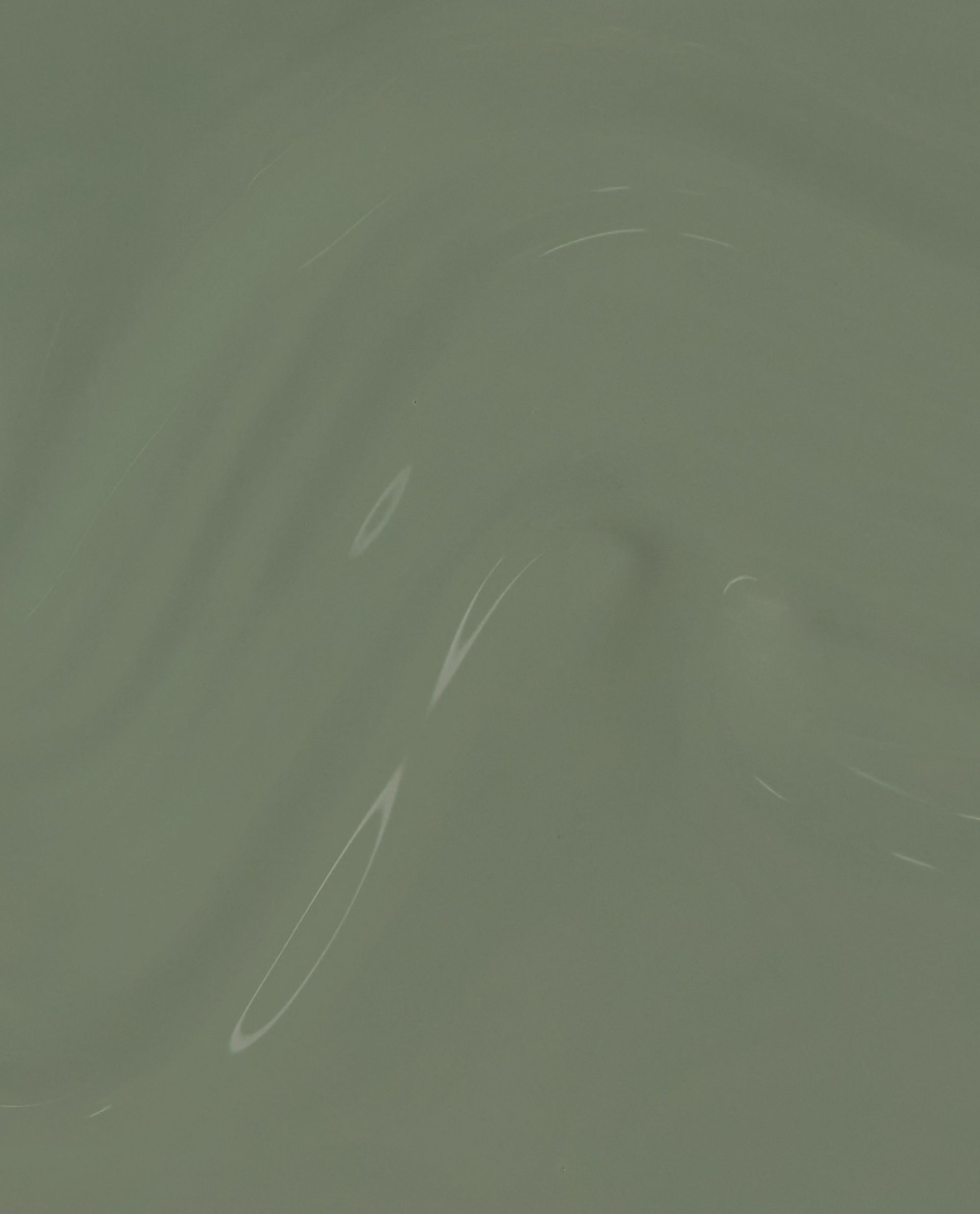 Cargo All Out nail lacquer swatch rippling in glossy sage green with creamy, opaque coverage; green nail polish perfect for spring nail colors and OPI fans, showcasing smooth finish and subtle shine.