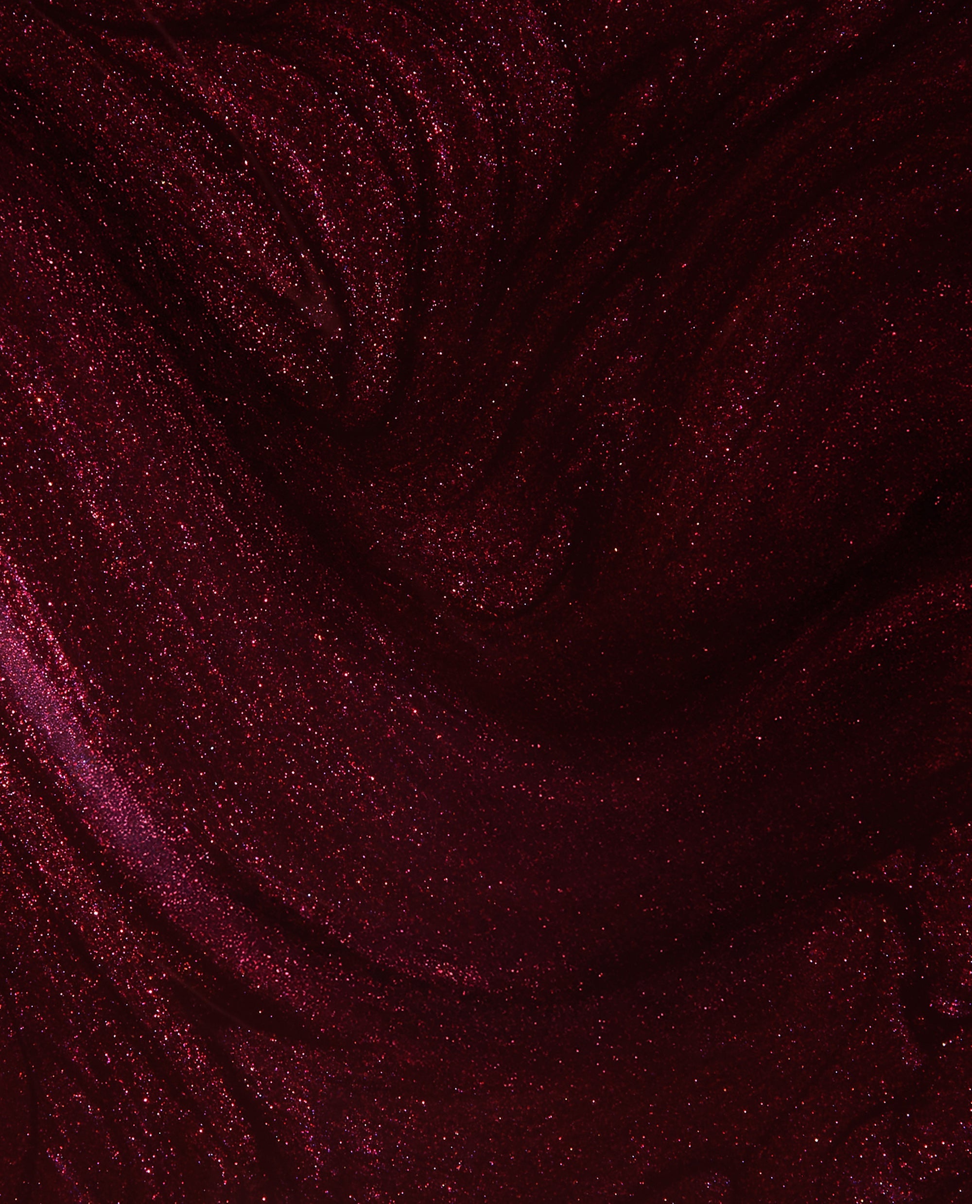 Every Month is Oktoberfest OPI gel nail polish swatch showing a deep burgundy wine shade with red shimmer and glossy metallic sparkle, ideal for rich fall nail colors.