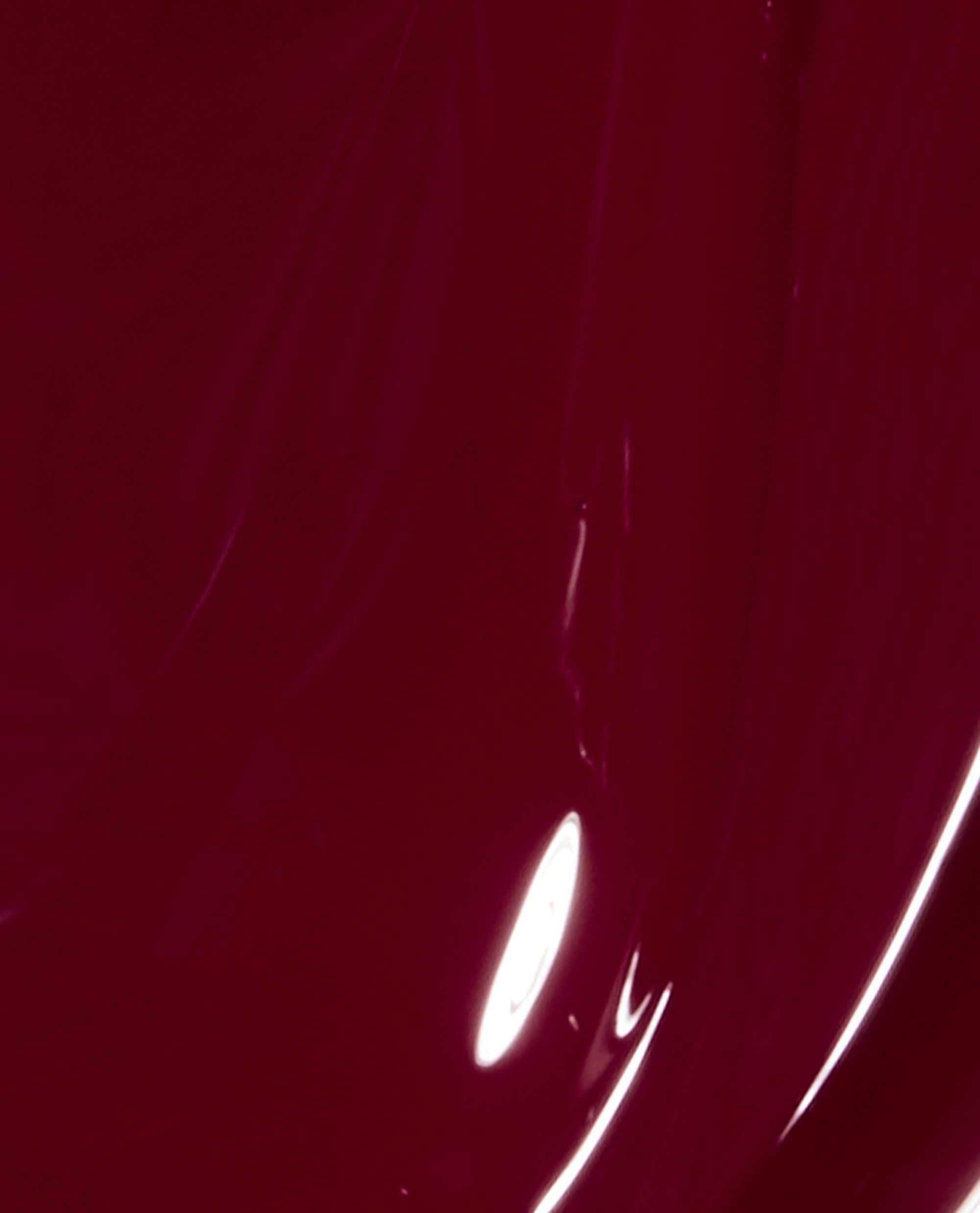 OPI Malaga Wine nail lacquer shown as a glossy deep burgundy brush swatch, highlighting a rich wine-red shade ideal for fall nail colors.