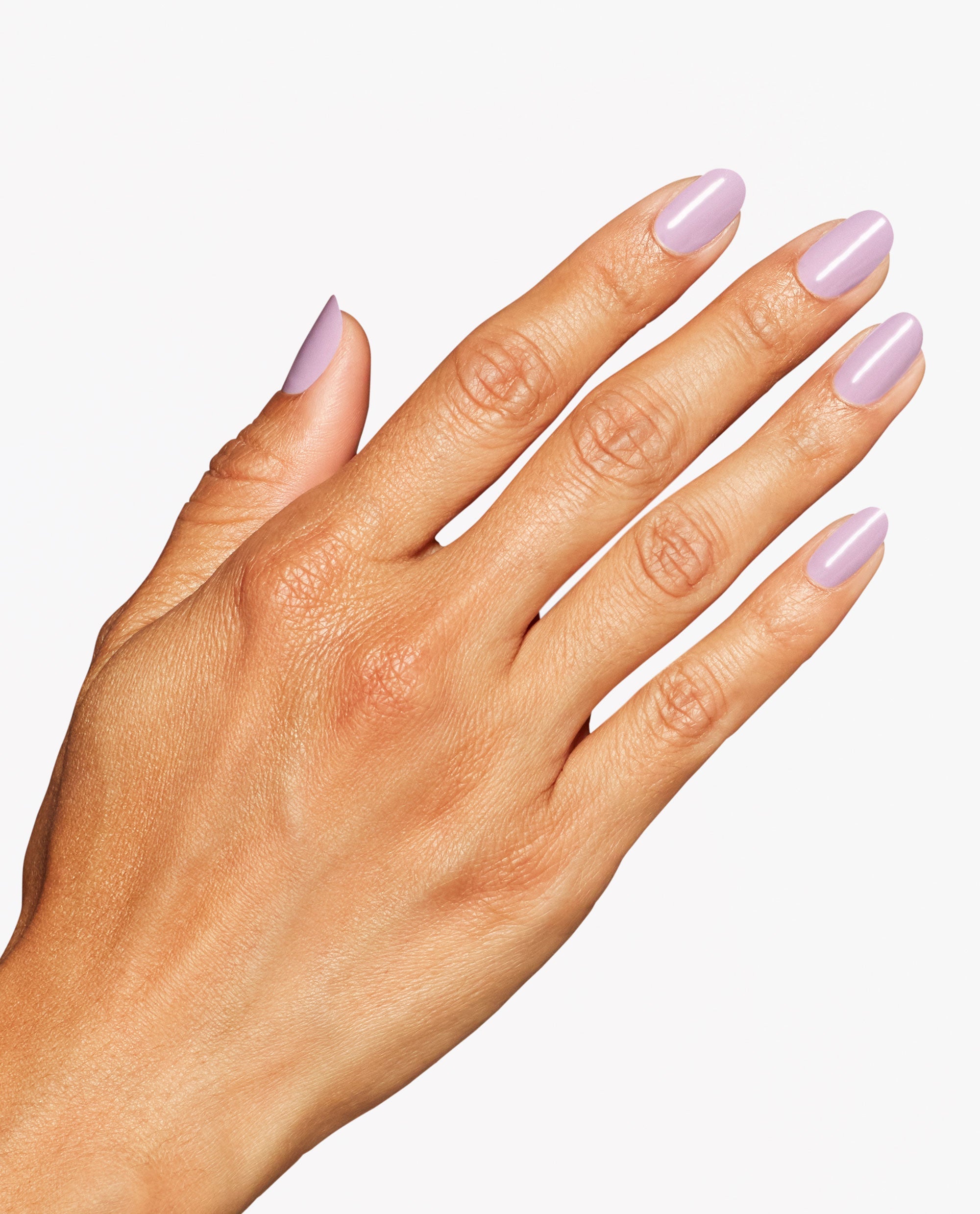 Hand shows a glossy pale lavender-pink manicure with OPI Mod About Me Nail Lacquer on rounded nails against a clean white background.