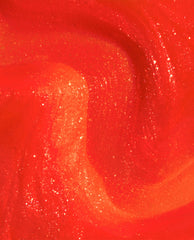 OPI Shock Em Orange Infinite Shine nail polish swatch shows a trending vivid orange-red gel-like lacquer with glossy shimmer and golden sparkle in a close-up texture.